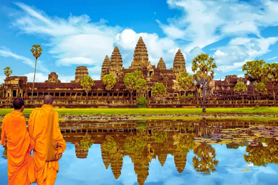 Buddhist monks facing Angkor Wat temple reflection in Cambodia – Auasia Travel